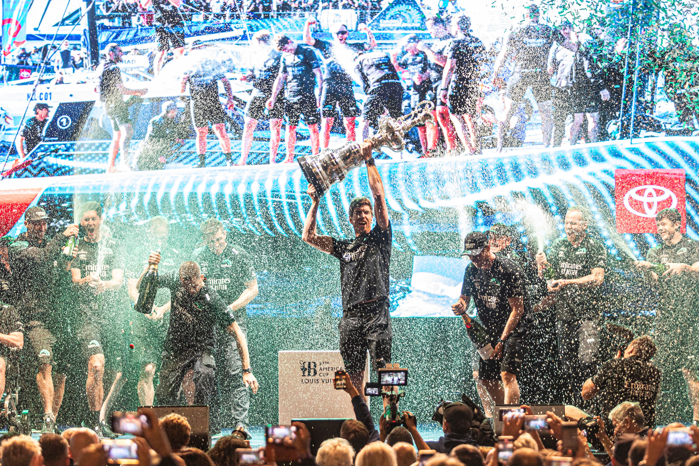 Emirates Team New Zealand celebrating their historic treble win. Photo credit: © Ivo Rovira / America's Cup